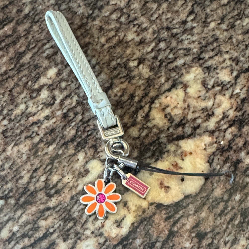 Coach White Wristlet with Orange Flower Phone Charm